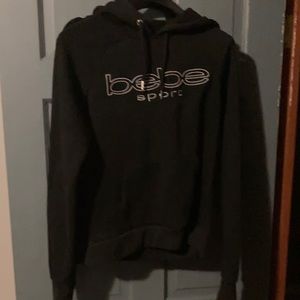 Women’s black Bebe size large hoodie.
